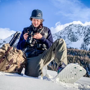 Robert Behrens - founder of Snowfoot Snowshoes taking pictures in the Italian Alps in Snowfoot branded gear