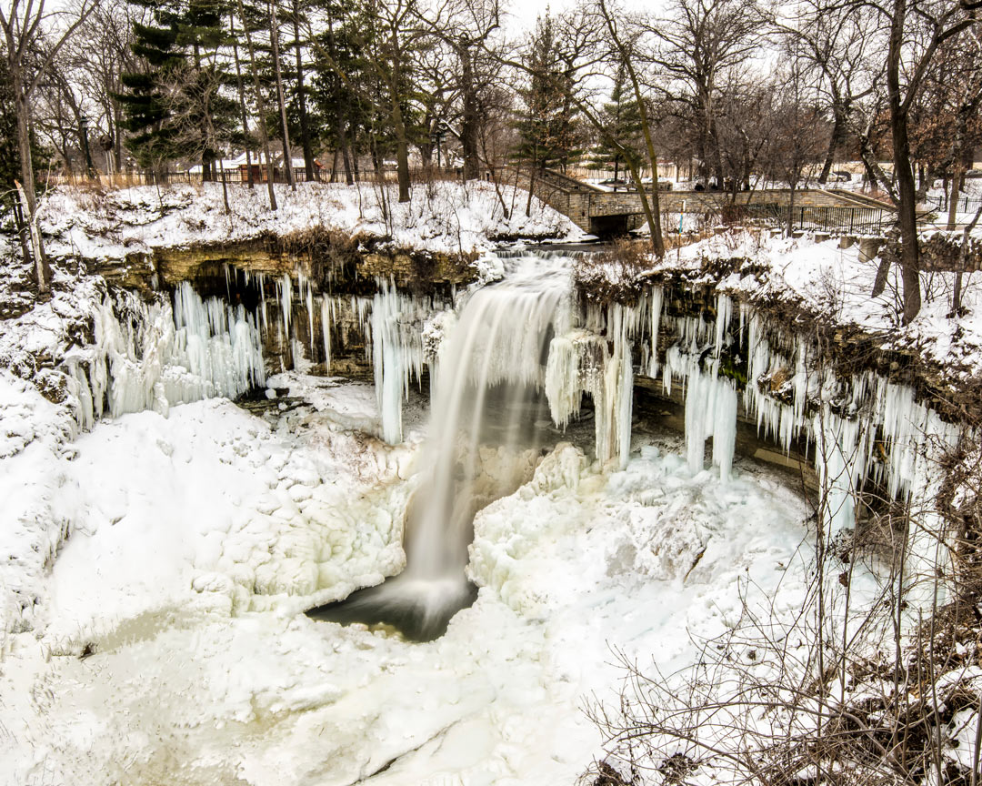 A drone shot of Minnehaha Falls in Minneapolis frozen due to the winter cold