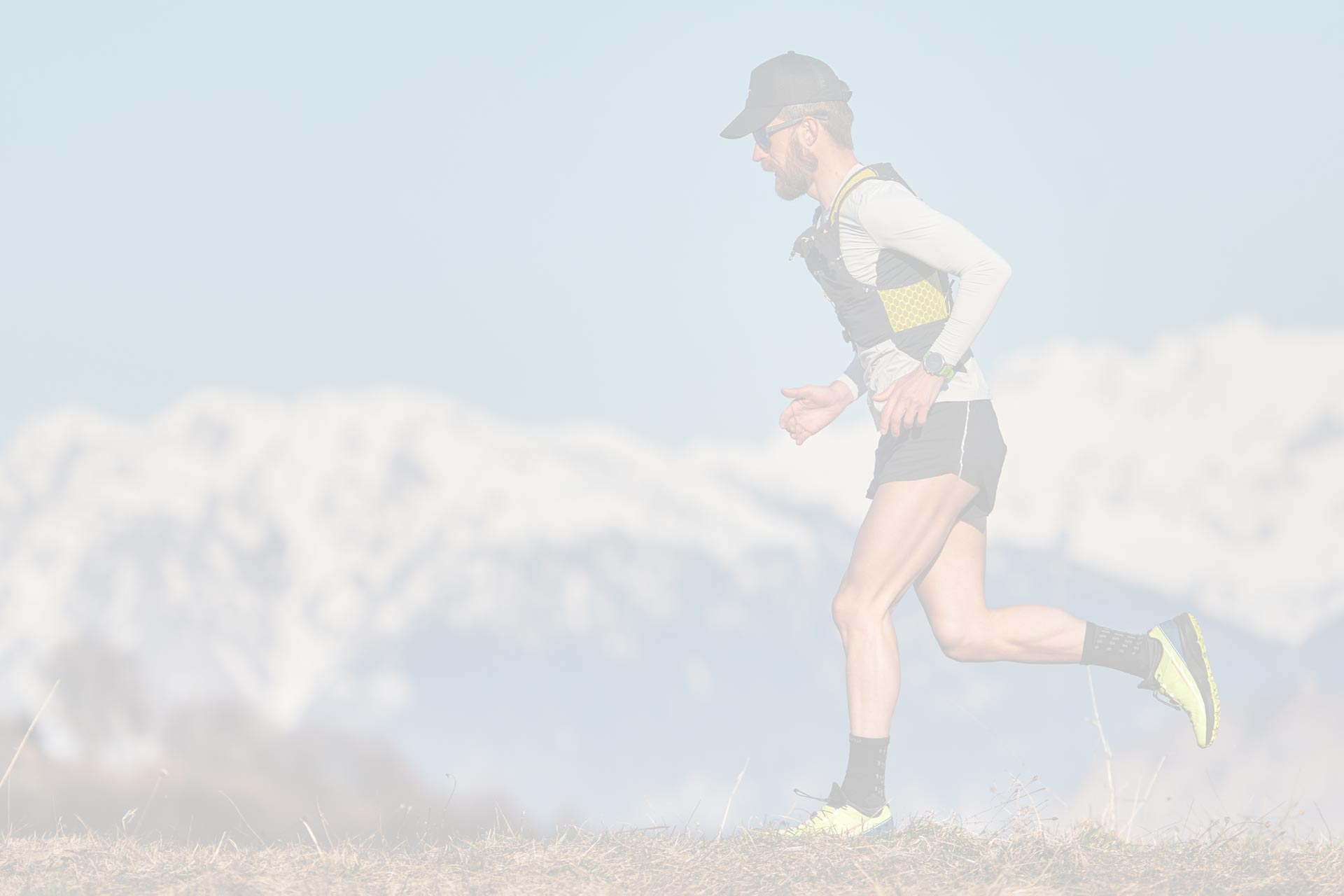 person running at high altitude through the Rocky Mountains